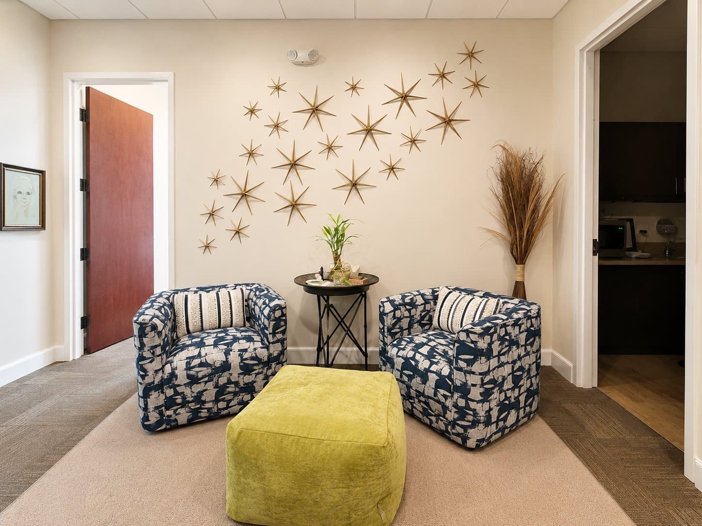 Cozy waiting area with two armchairs at Delray Beach Counseling